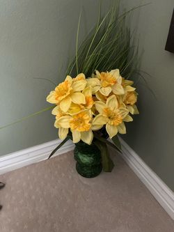 Green vase with flower