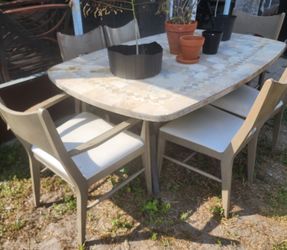 Granite Table And Wooden Chairs 