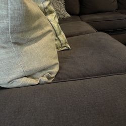 Grey Sectional and Ottoman With Storage 