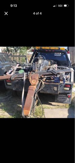 Self loader tow truck bed