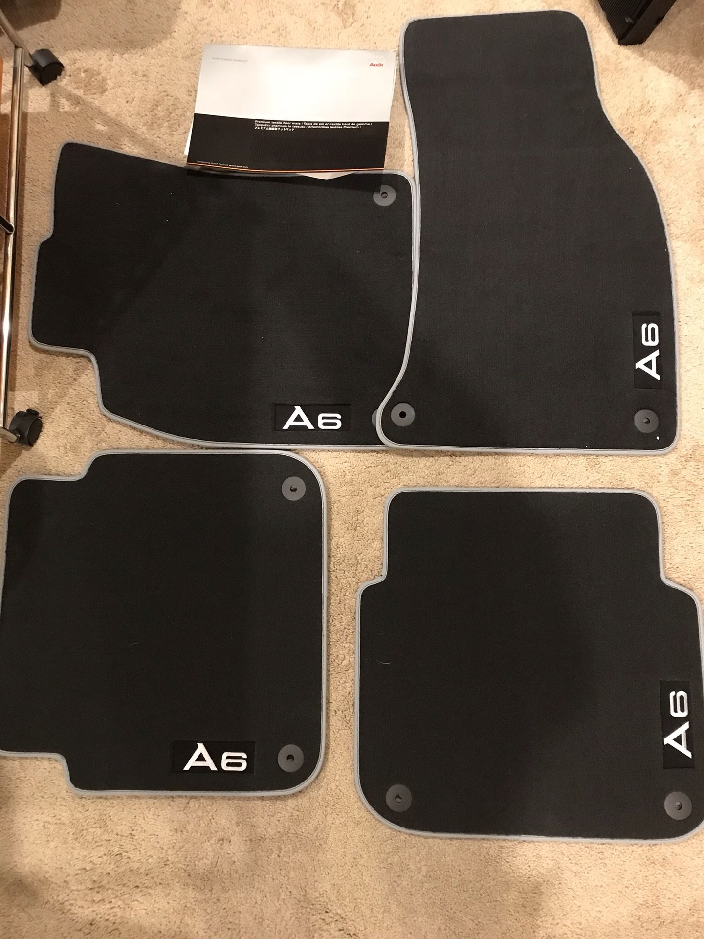 Audi A6 set of floor mats. Black cloth w/silver piping. BRAND NEW