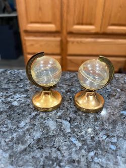 Vintage  World Globe Clear Plastic on Gold Tone Stand .  Size approximately  2 1/4 inches tall.  Preowned.  Has been on display in a cabinet with a ve