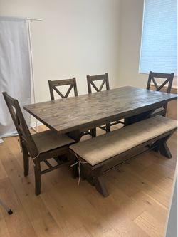 Wood dining table with chairs and bench