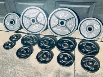 NEAR MINT/ EXCELLENT CONDITION: Complete Set Nautilus Olympic Weight Plates In Cast Iron! NAUTILUS CYCLONE & Seashell Olympic weight plates featuring 