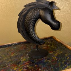Metal horse head statue