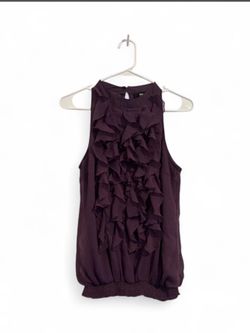 Purple ruffle sleeveless top with a flowy, boho vibe.