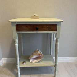 Antique two-tiered organic  wood table refinished in a shabby chic/coastal chic style