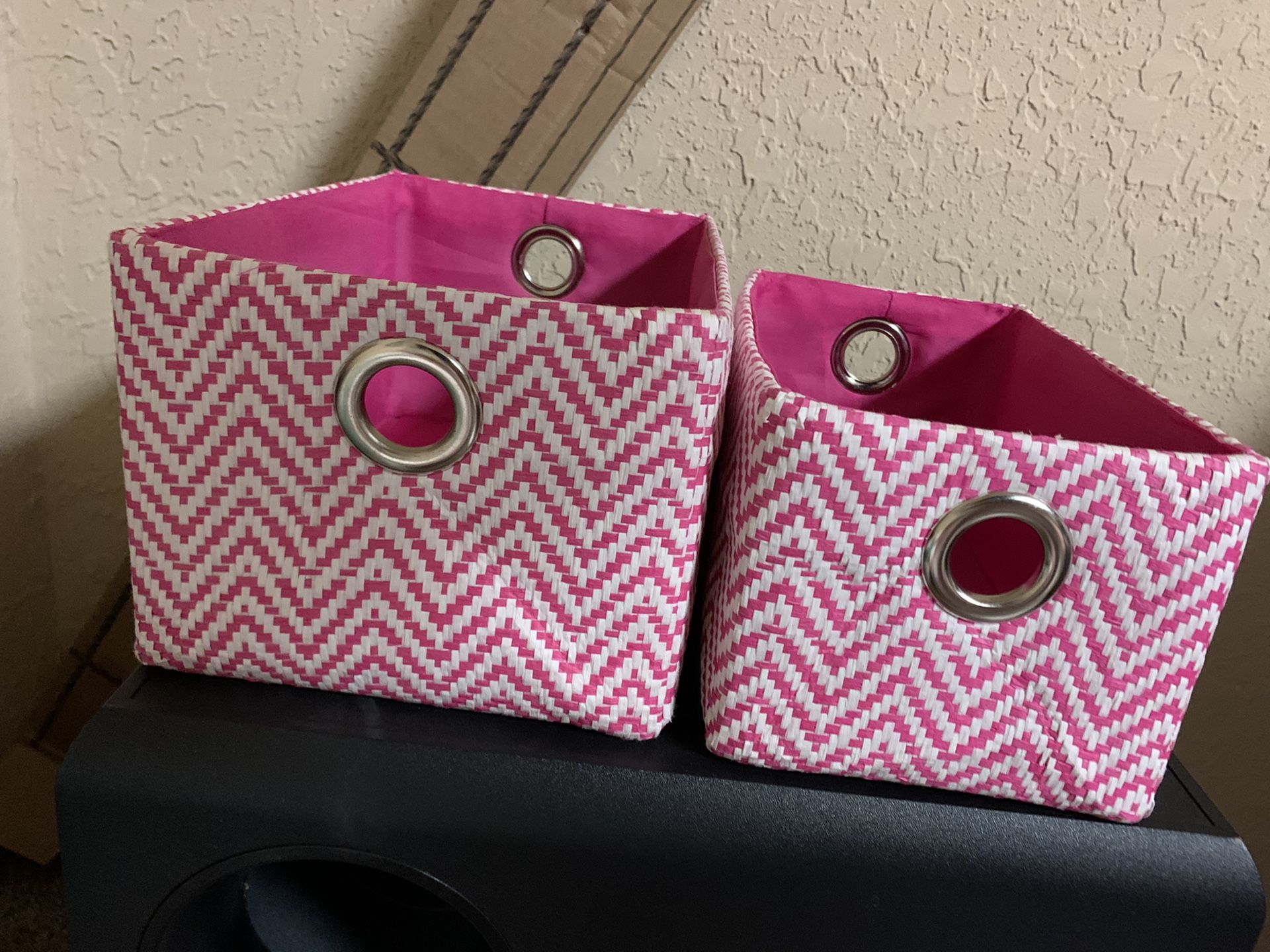 2 pink storages containers