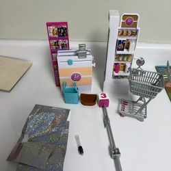 Barbie grocery store and camping playsets. 