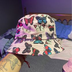Pink bucket hat with butterfly pattern