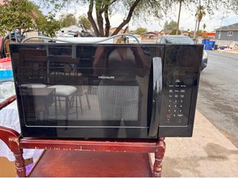 Frigidaire FMOS1846BB 1.8 cu. ft. over-the-range microwave in black.
