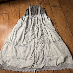 A striped maxi dress with a button-down front, spaghetti straps, and lace trim details Small on tag  Very good condition  Smoke free home