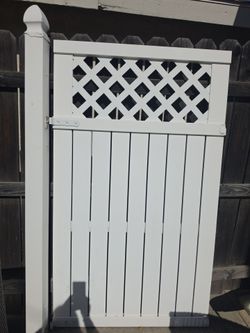 Gate white small area side house needs new lock 300