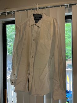 white Nautica button-down shirt featuring a chest pocket and a grey collar lining