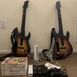 Nintendo Wii Complete Bundle – 7 Games, 4 Remotes, 2 Guitars – $175 OBO
