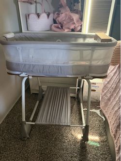 Gray Baby Bassinet with Wheels and Storage