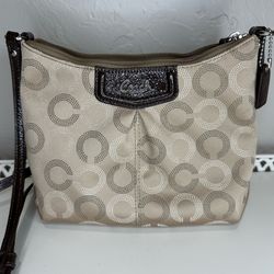 Small cross body coach purse with pink interior