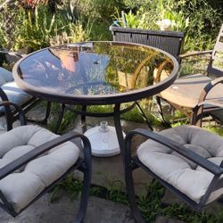 Glass Patio Table With 4 Rod Iron Chairs