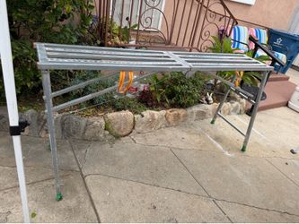 6’-7” wide portable scaffold.  Aluminum, adjustable , folding can hold up to 800 lbs!