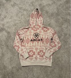 Ariat Women's Southwestern Print Logo Hoodie features a distinct pink and tan geometric pattern and a prominent branded graphic (Medium)