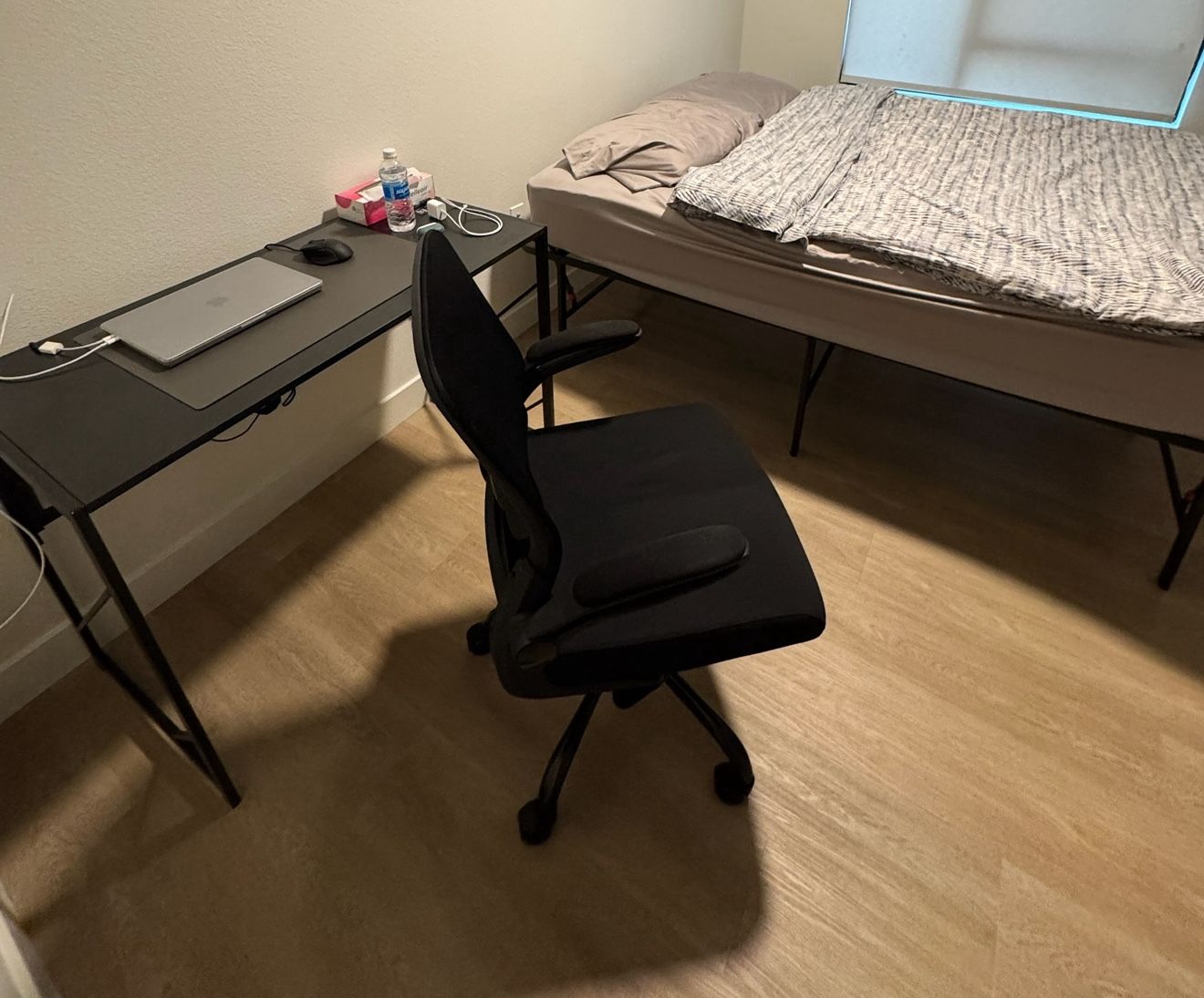 Bed, Table And A Chair