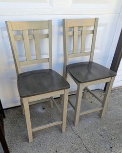 2 heavy solid wood dining room chairs