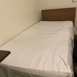 Twin sized mattress with spring board below