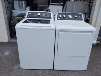 Flawless like new GE matching top load washer dryer set with warranty