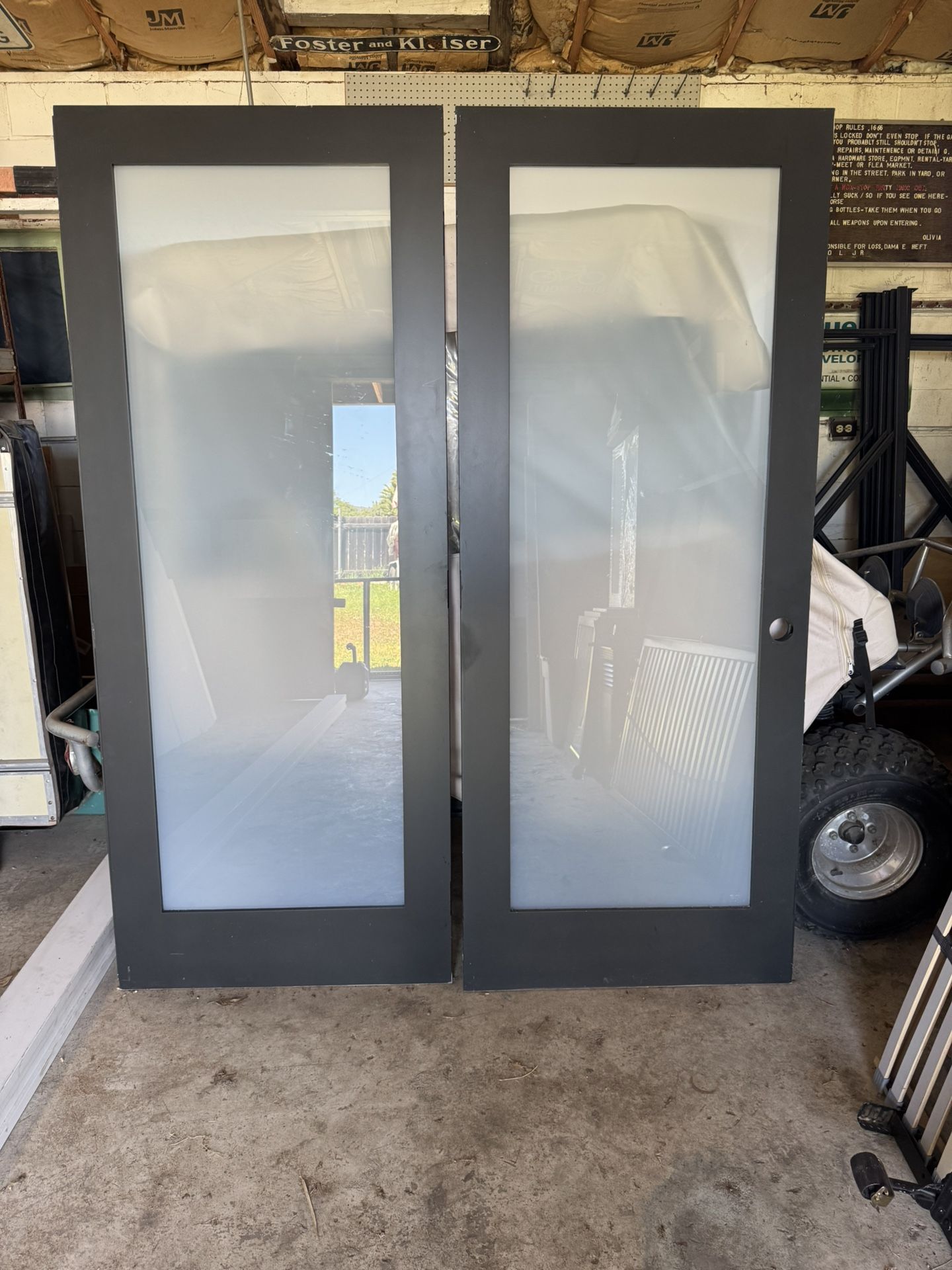 Black Solid Core Shaker Doors With Smoked Glass Inserts.