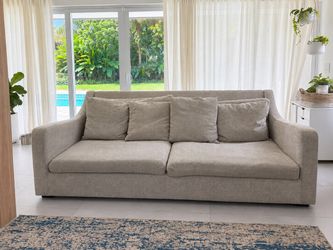 Crate & Barrel Verano sofa in light gray textured fabric.