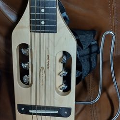 Traveler acoustic guitar with bag. Good condition.