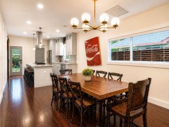 Custom Wood Plank Dining Table with six chairs.