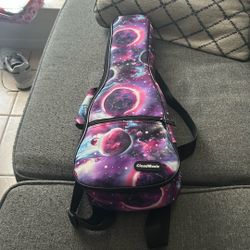 This Guitar Is Small, But It Works Really Well. It Sounds Like A Normal Guitar And It’s Really Pretty. It’s Like A Dark Pink