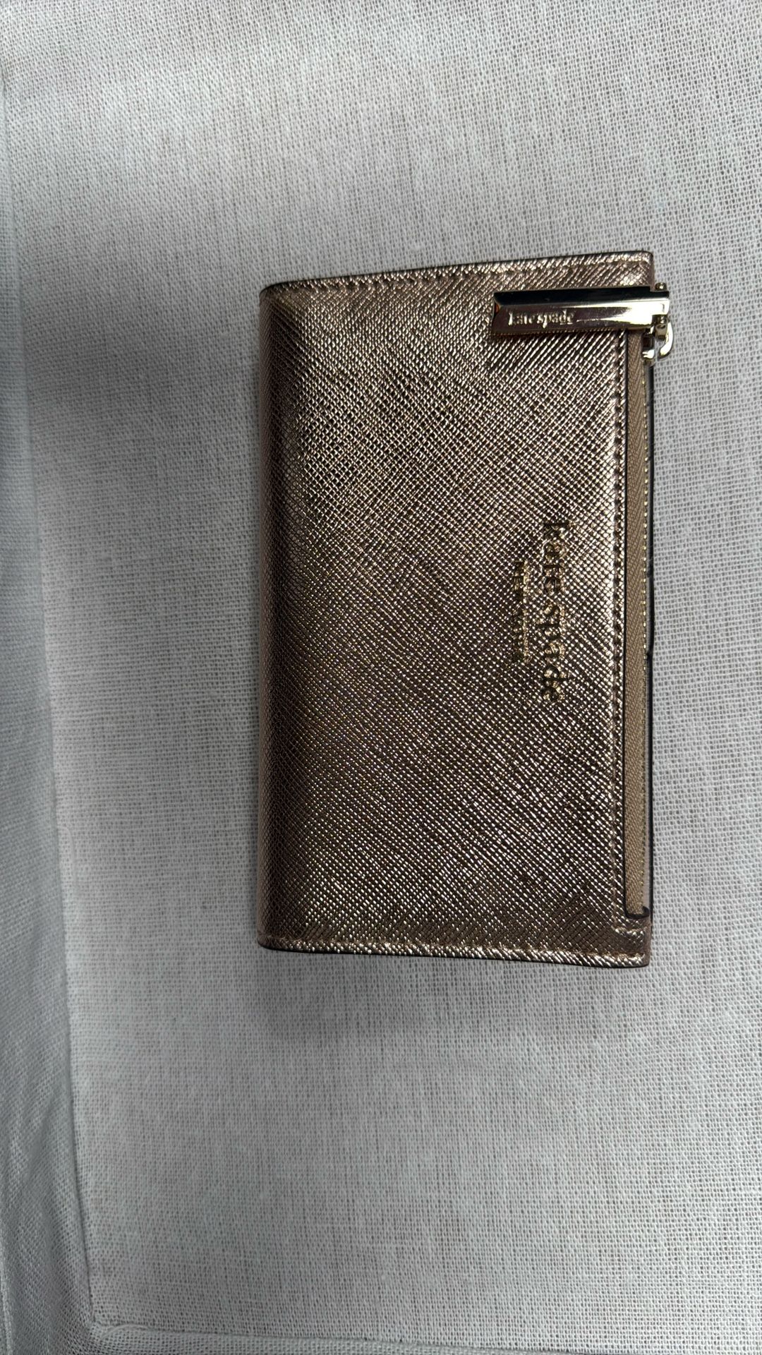 Kate Spade Spencer Metallic Small Slim Bifold Wallet in rose gold