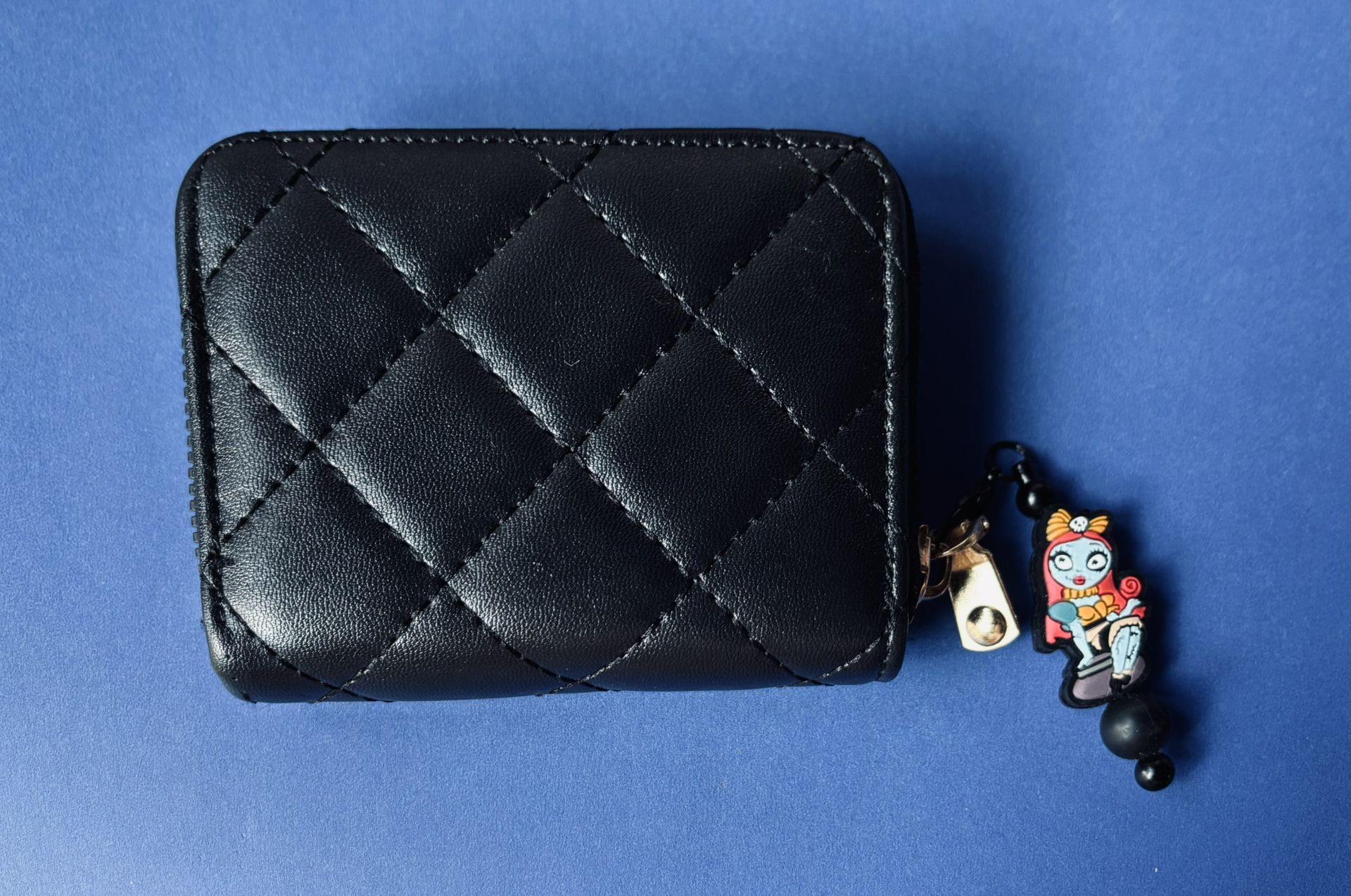 Black Quilted faux leather wallet With keychain charm Sally from The Nightmare Before Christmas.