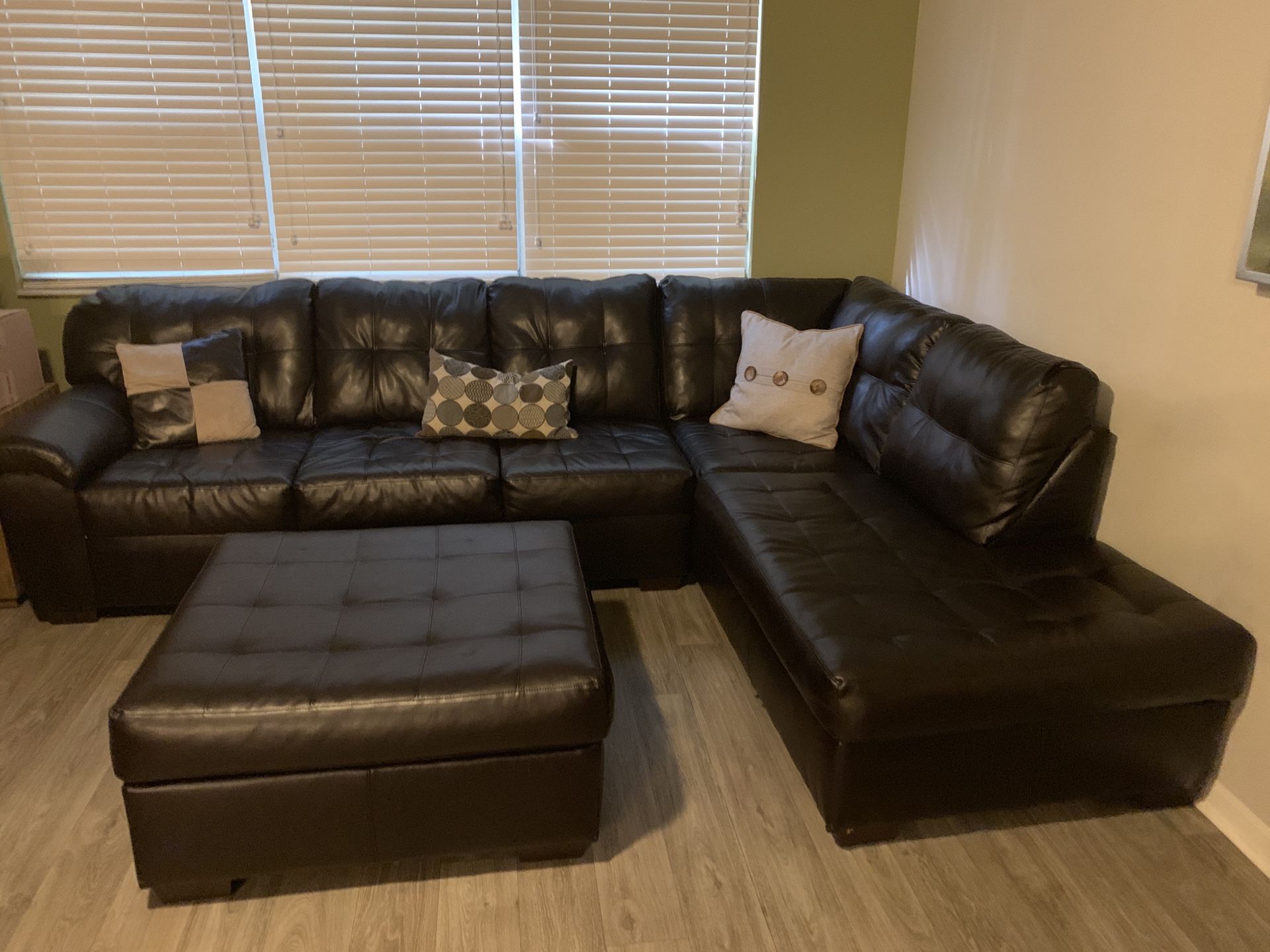 Sectional sofa in great condition has small area in back edge has small tear bottom of sofa