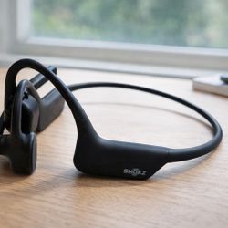 Great Shape + Battery Life - SHOKZ OpenComm2 UC bone conduction headphones with case and adapter.