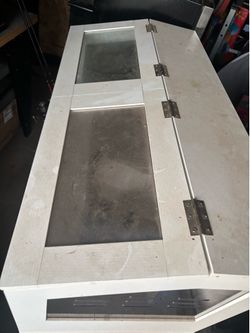 Hamster enclosure with storage bottom