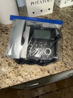 Landline phone and associated cordless phone and small base