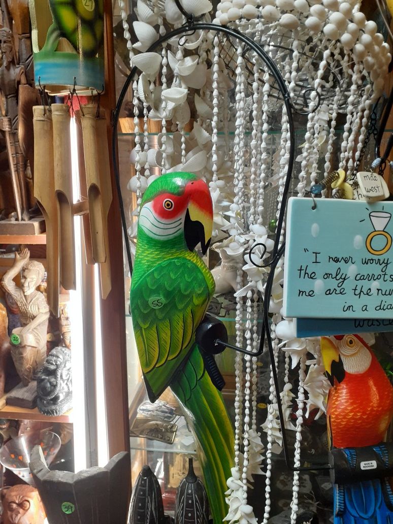 Weekend special on this large colorful carved wooden parrot on a swing