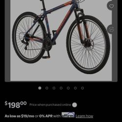 Mongoose Exhibit Mountain Bike, 29-inch wheels, 21 speeds, blue