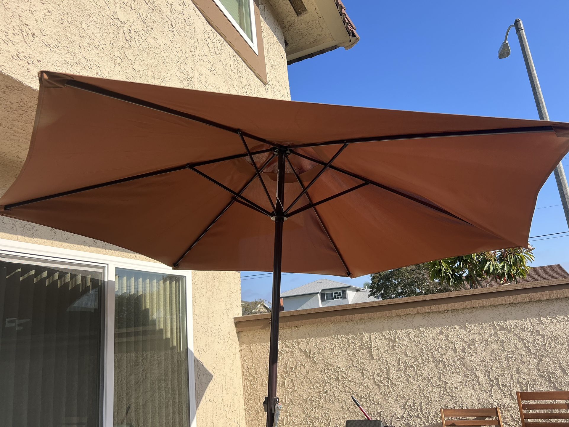 9  ft. Powder-Coated Steel Crank Patio Market Umbrella in Brown With Base