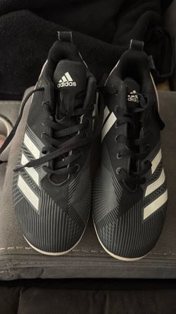 Black and white Adidas Cleats