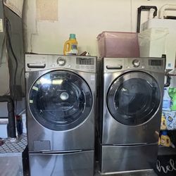 LG Washer And Electric Dryer With Pedestals
