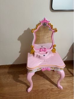 Girl toys with Cinderella dress