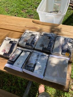 Seven packages Of new curtains.
