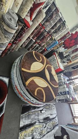 Round Brown Area Rug with Swirl Pattern