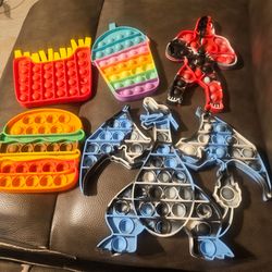 Pop Its- Charizard, King Kong, hamburger,  fries,& slushie