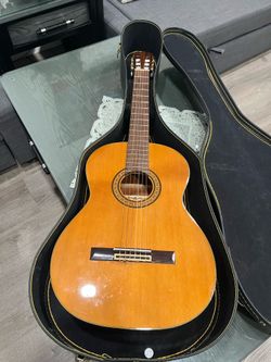 A acoustic guitar with case