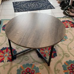 Round table dark wood grain 31” wide 16” tall